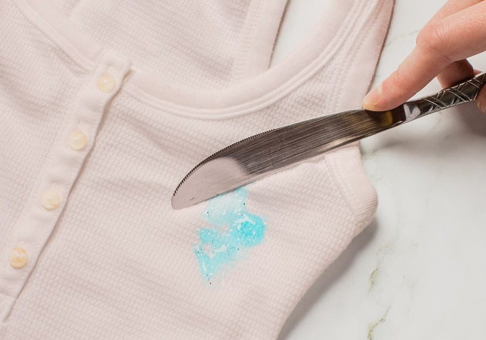 get nail glue out of clothes